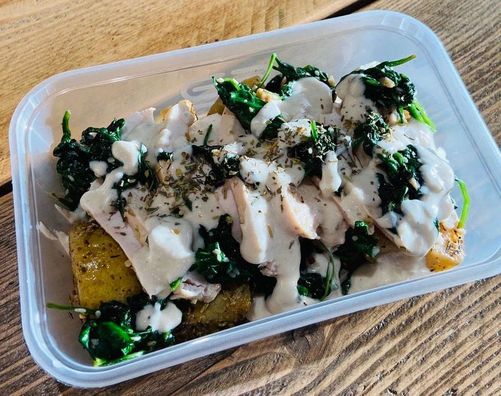 Chicken Breast Topped with Sautéed Kale & Peppercorn Sauce Served Over Herby Potatoes