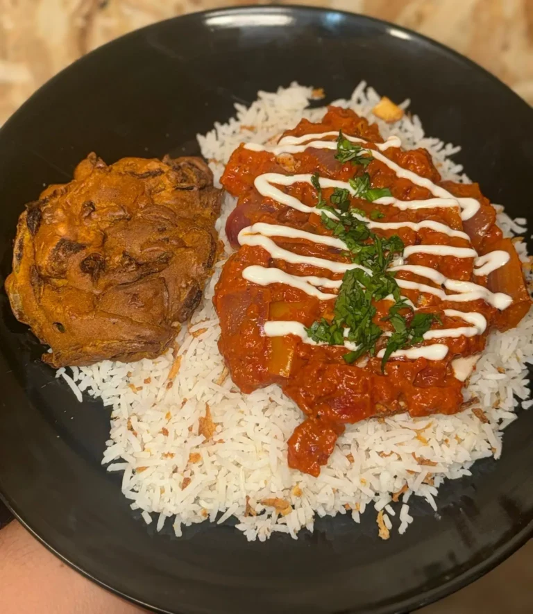 Slow-cooked Bhuna curry with chicken, crispy onion rice, and onion bhaji. High protein, bold flavours, and comforting Indian-inspired meal.