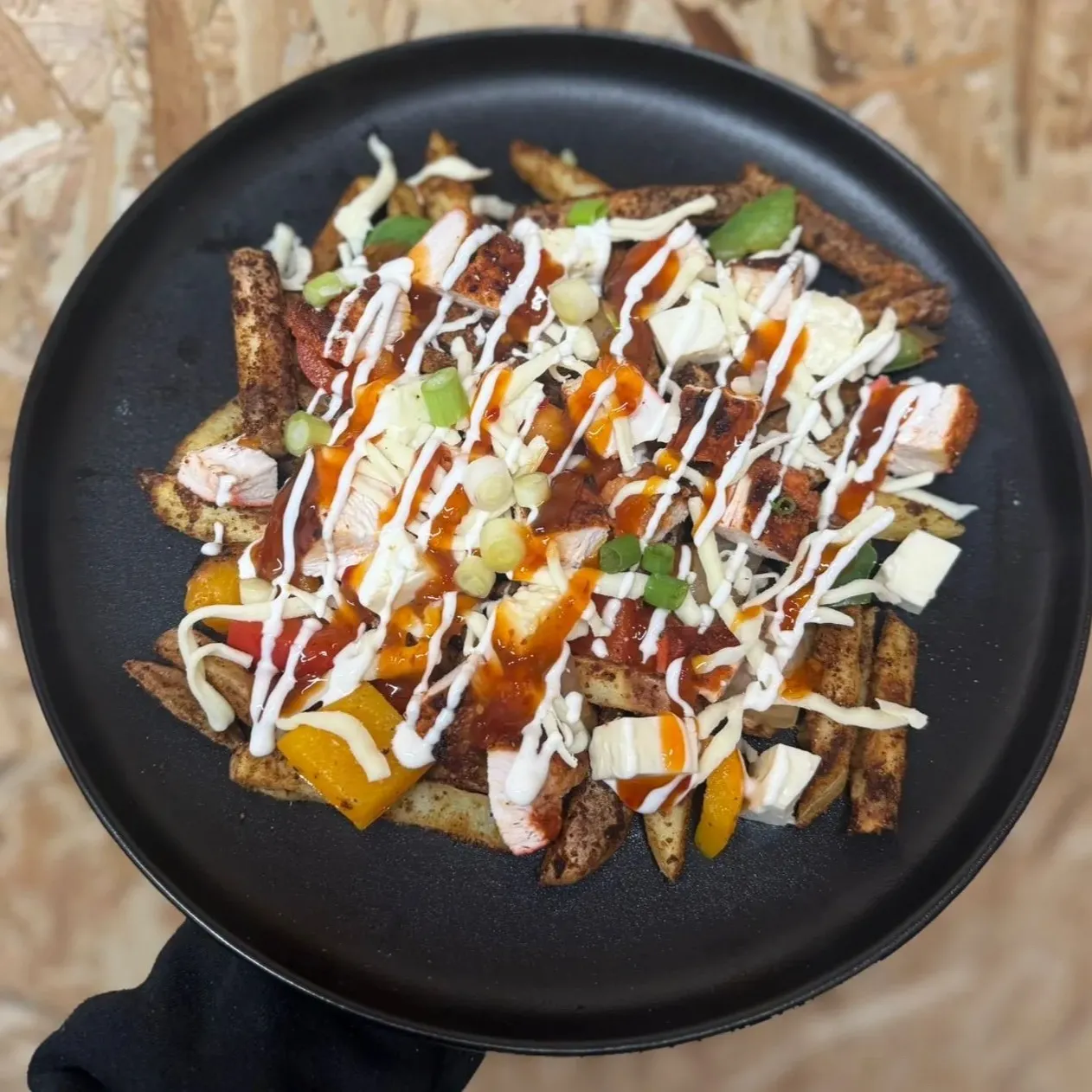 Piri Piri Chicken & Halloumi Loaded Fries with 33.8g protein. Smoky, spicy fake-away comfort food with balanced macros.