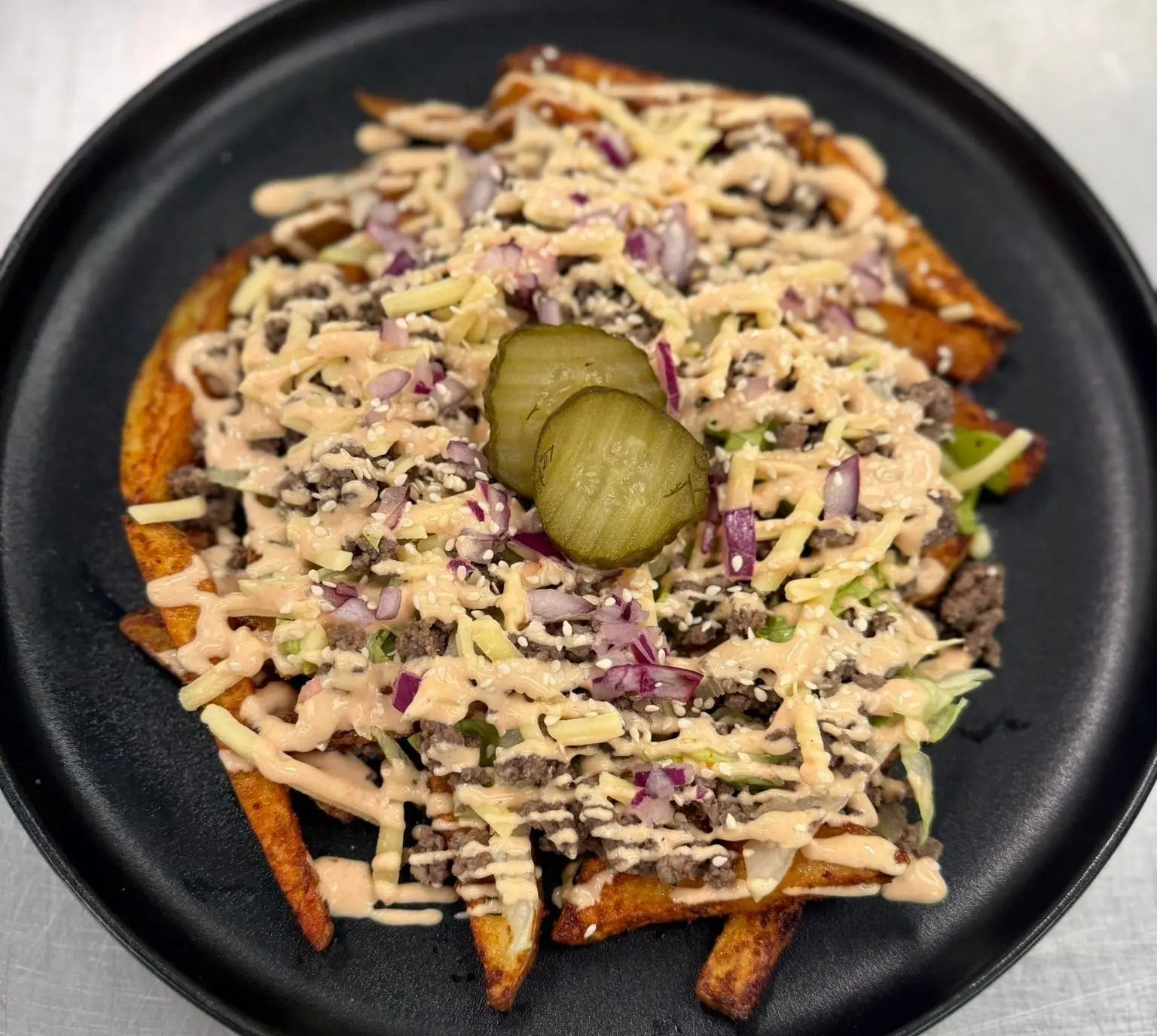 Big Mac Loaded Fries with beef mince, cheddar, lettuce, gherkins and tomato sauce