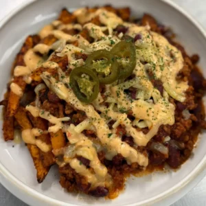 Loaded Sweet Potato Fries with beef chilli, melted cheddar and fresh toppings