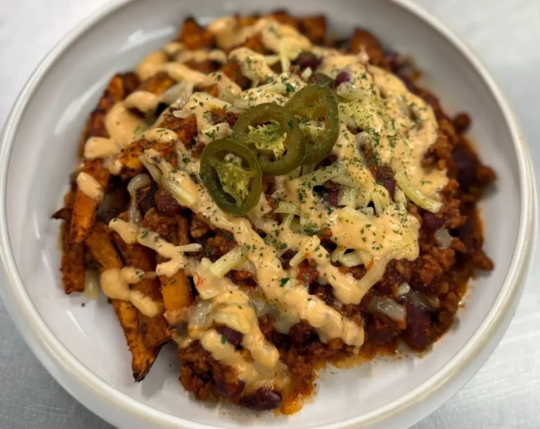 Loaded Sweet Potato Fries with beef chilli, melted cheddar and fresh toppings
