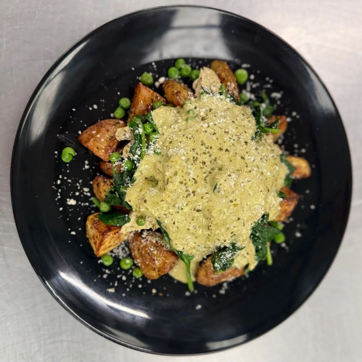 Pesto Potatoes with chicken, peas, spinach and double parmesan