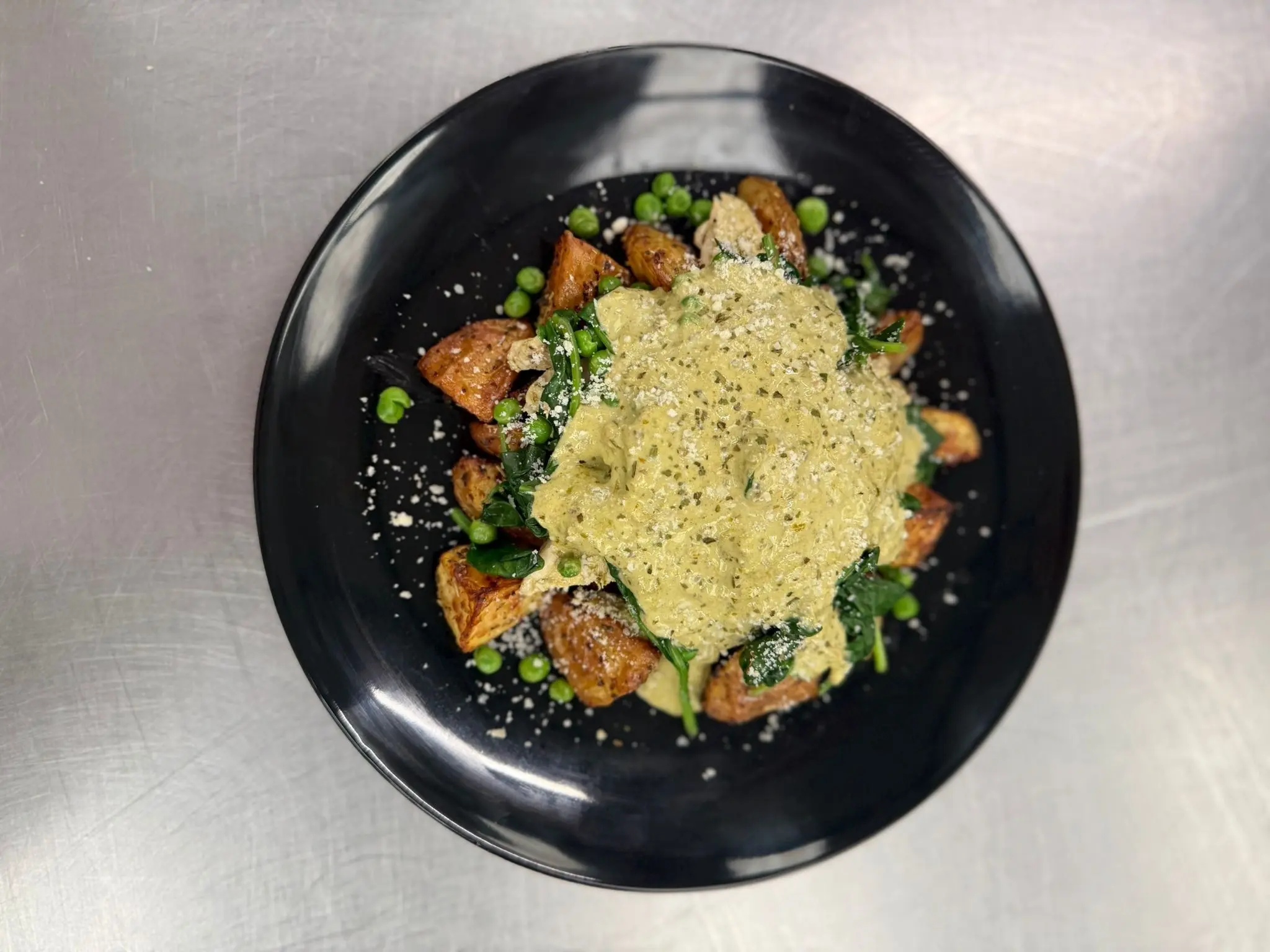 Pesto Potatoes with chicken, peas, spinach and double parmesan